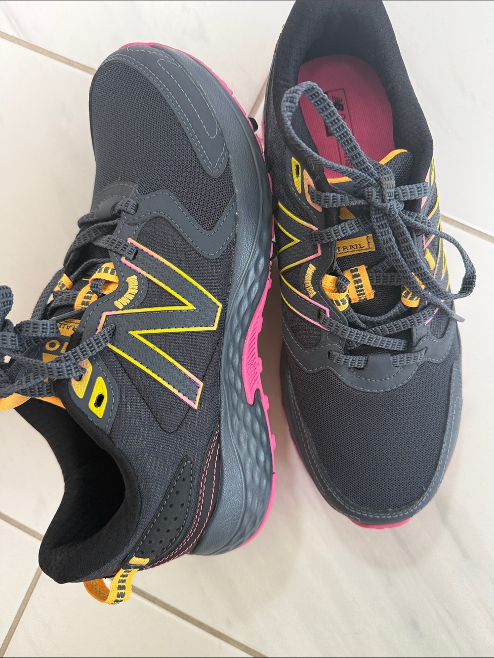 New Balance 410 trail runners Black Sneakers with Yellow & Pink Accents